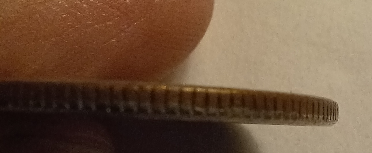 1982-Quarter-With-Copper-Showing-Through-Face.-Cladding-Error?